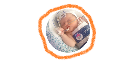 A header image with a newborn wearing a cooling jacket surrounded by ring of orange crayon