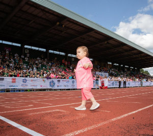 Mia crossing the finishing line at the British Transplant Games