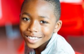 Young boy smiles 