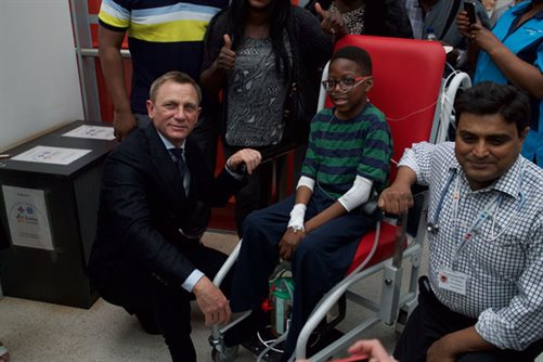 Daniel Craig and young patient Aaron Aryitey at Evelina London
