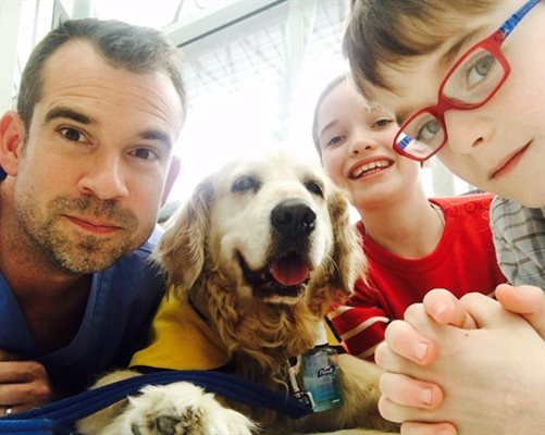 Dr Chris with patients and Nala for Operation Ouch