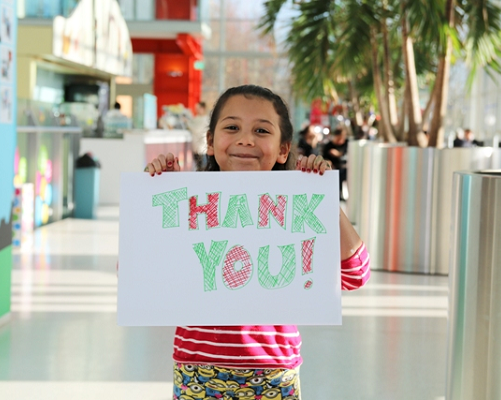 Girl with a thank you card