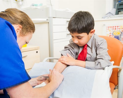 Young boy receives an allergy test from a nurse