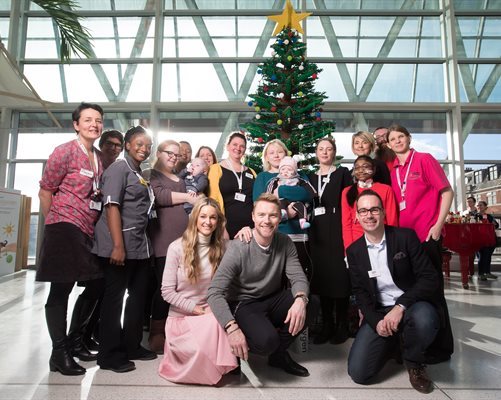 Ronan and Storm Keating with staff and families at Evelina London