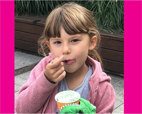 Six year old Emily Pratt who has benefitted from the peanut study eating ice cream