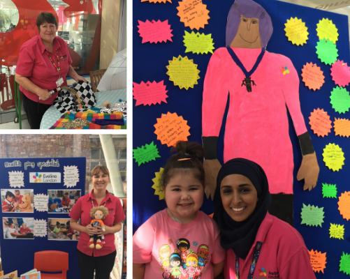 Play specialists at an exhibition to celebrate play in hospital week and a young girl with a painting of a play specialist