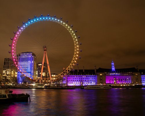 The London Eye lit up in Evelina London colours