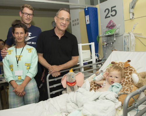 Tom Hanks visiting baby Roman and family at his hospital bed.