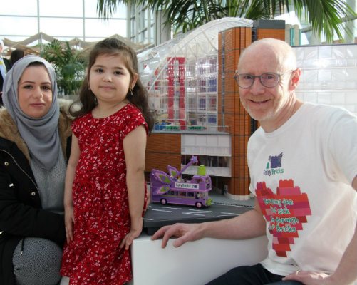 One of our young patients with her mother and the designer of our hospital&amp;#39;s LEGO model