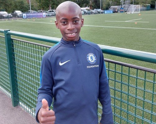 A boy at a football sports camp