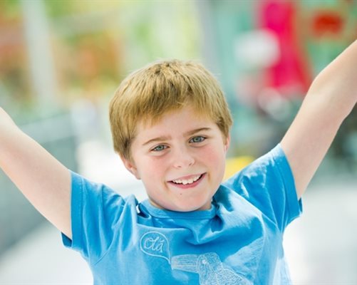 Boy with arms in the air