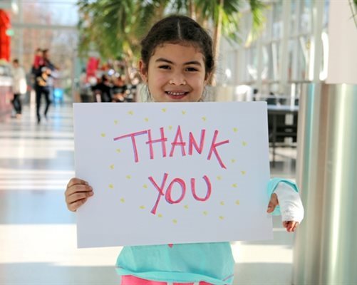 Girl with a thank you card