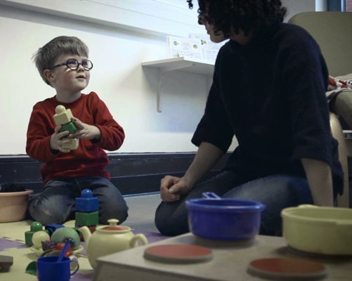 Boy and mother at a speech and language therapy session