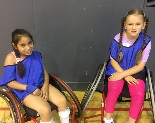 Catalina Diaz Gomez and Skye McWalter at a wheelchair basketball event