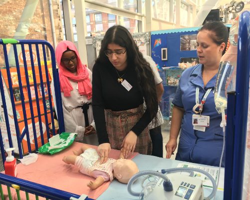 Students learning how to resuscitate a baby from our nursing team.