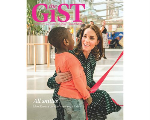 The front cover of the GiST magazine showing The Duchess of Cambridge crouched down with a young patient