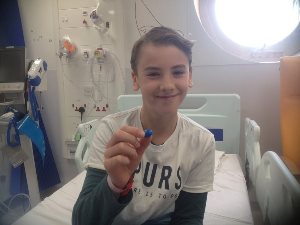 Boy on hospital bed at Evelina London receiving treatment