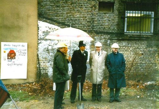 Sir Cyril Chantler laying a stone for Ronald McDonald House.