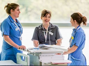 Three PICU nurses working together