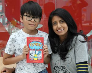 Konnie with her book and an Evelina London patient