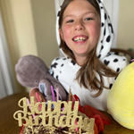 Evelina London patient, Emily, eating birthday cake