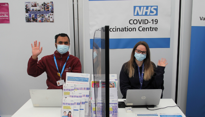 Members of the vaccination team welcoming patients to our vaccination centre